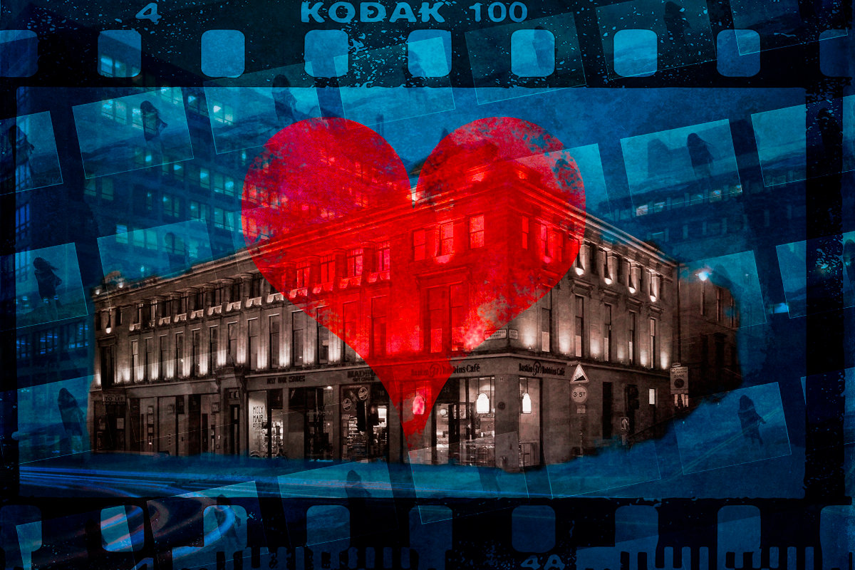 Heart superimposed over a building with photo negative