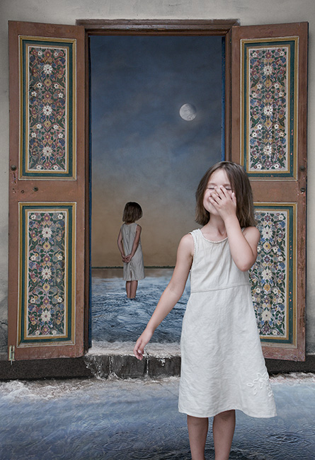 Photo montage of a child laughing in the forefront, looking at the moon in the rear