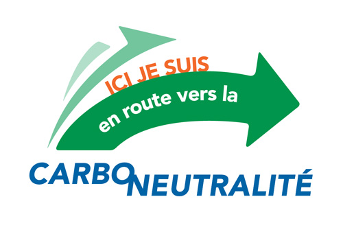 Logo with a green arrow that says here I am on my way to carbon neutrality